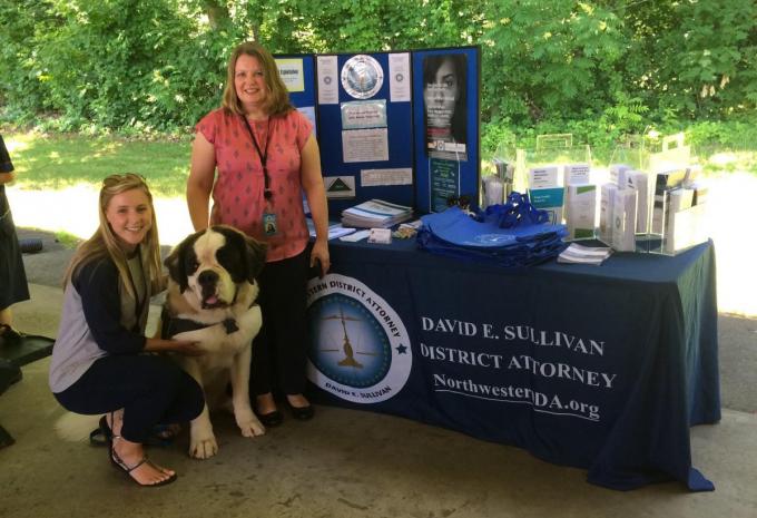 photo of Consumer outreach specialists and police therapy dog