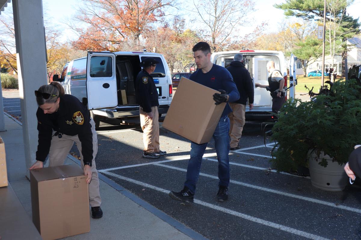 Law enforcement from the DEA, local police and Hampshire and Franklin Sheriff's office unload boxes of drugs in Northampton.