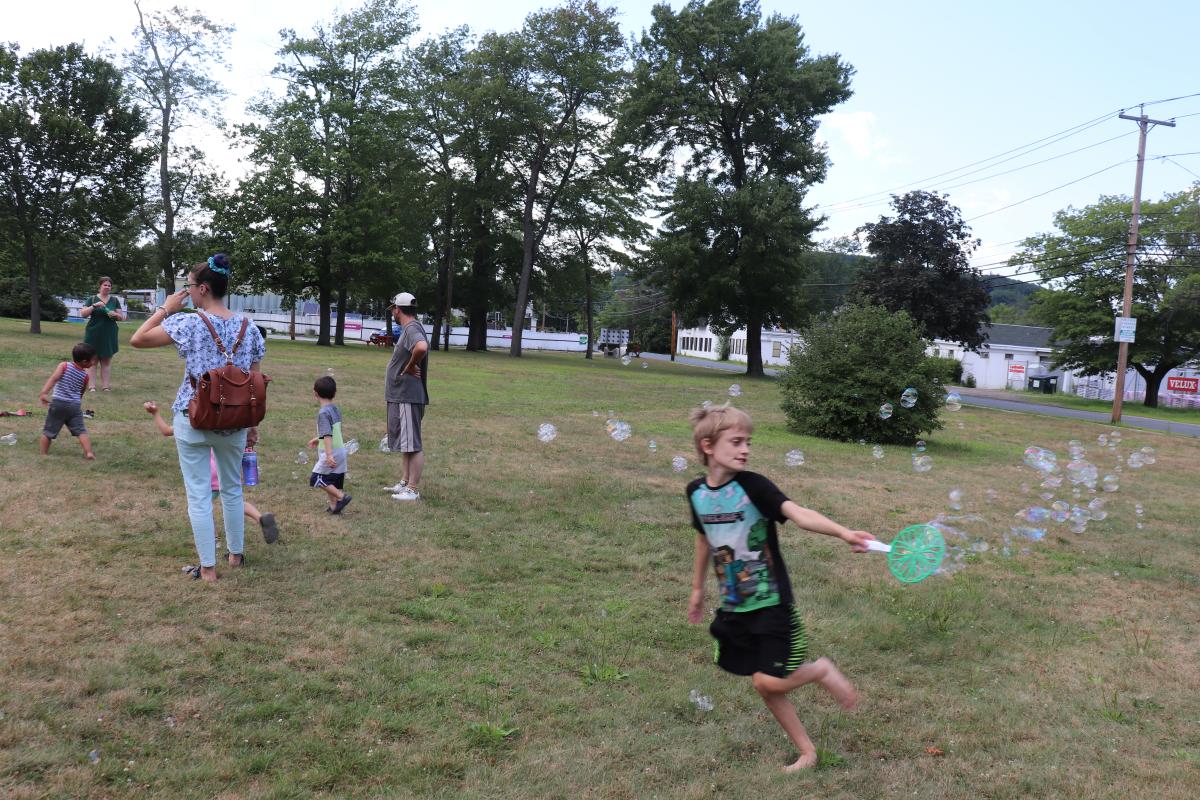 Bubble making and corn hole playing were among the activities at the Orange NNO celebration.