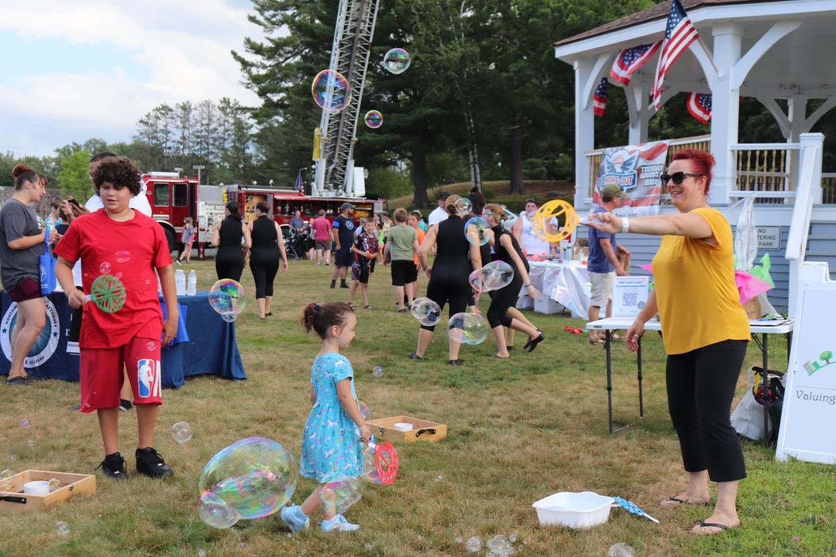 Bubble making and corn hole playing were among the activities at the Orange NNO celebration.